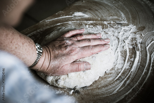 hands baking bread together