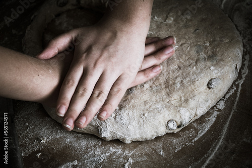 hands baking bread together