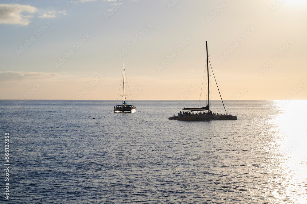 Catamarans at sunset