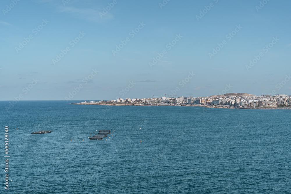 Panoramic view of Saint Paul's bay with fish farm on a sunny summer day Panoramic view of Saint Paul's bay with fish farm on a sunny summer day