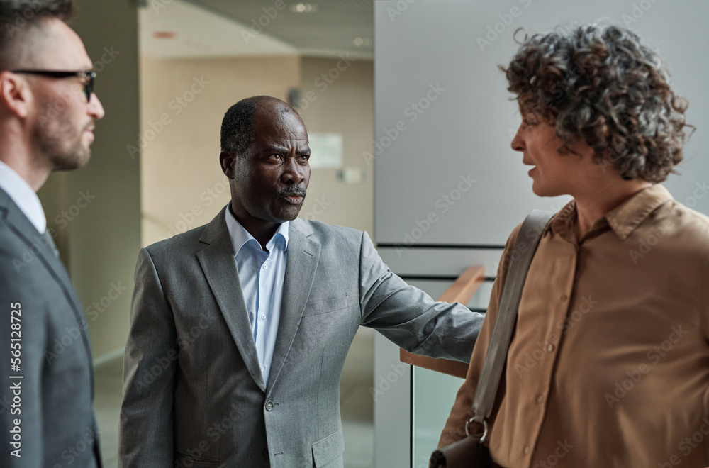 Strict mature boss dissatisfied with female subordinate scolding her at meeting while explaining reason for his discontentment Strict mature boss dissatisfied with female subordinate scolding her at meeting while explaining reason for his discontentment
