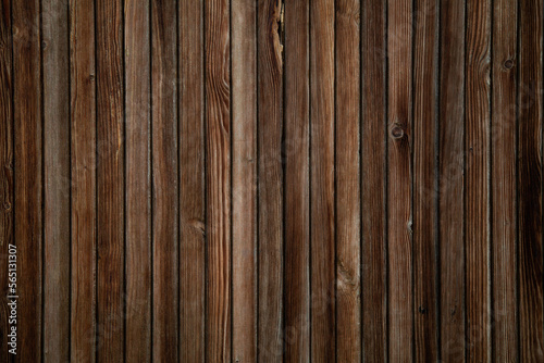 image of a wooden table on an abstract dark background with light in the center