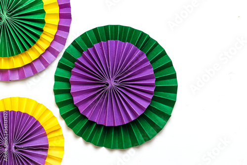 Mardi gras.Holidays mardi gras masquarade  venetian mask fan over purple background. view above mardi gras background copy space Happy Mardi Gras . Fat Tuesday carnival texture golden green purple