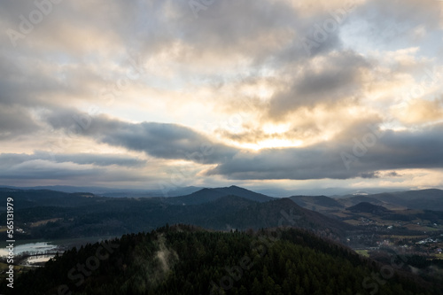 Bieszczady mountains. Cloudy sunrise in the mountains. Moody morning in the mountains. Sun through the clouds in the mountains. Sunrays in mountains.