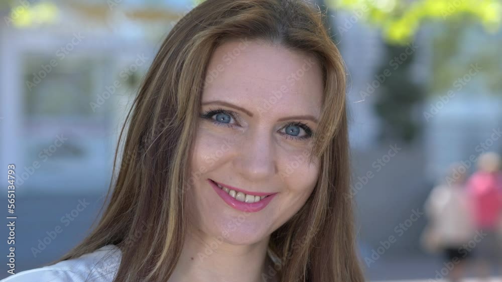 confidence, beauty - young attractive woman smiles seductively at the camera confidence, beauty - young attractive woman smiles seductively at the camera