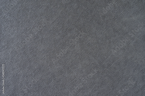 Texture background of velours gray fabric. Upholstery velveteen texture fabric, corduroy furniture textile material, design interior, decor. Ridge fabric texture close up, backdrop, wallpaper.