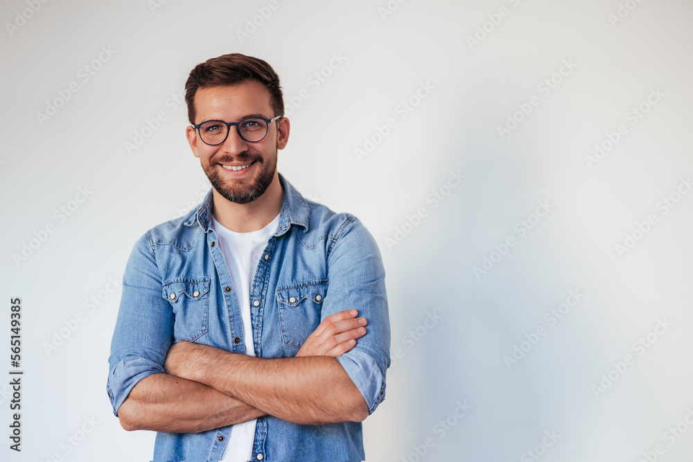 © kerkezz - Isolated shot of young handsome man with beard, wearing casual clothes, posing in studio on white background © kerkezz - Isolated shot of young handsome man with beard, wearing casual clothes, posing in studio on white background