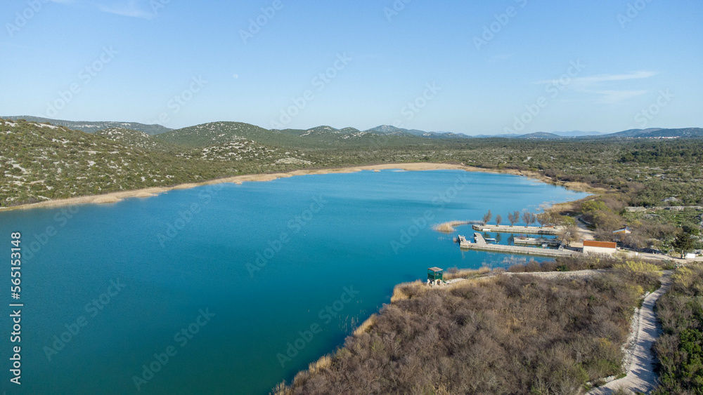 Vransko lake in Dalmatia, Croatia from above with views on Adriatic sea and islands.
