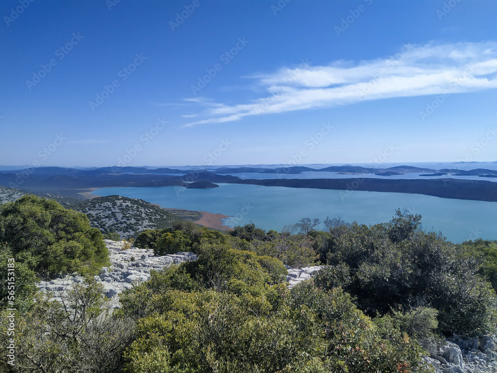 Vransko lake in Dalmatia, Croatia from above with views on Adriatic sea and islands.