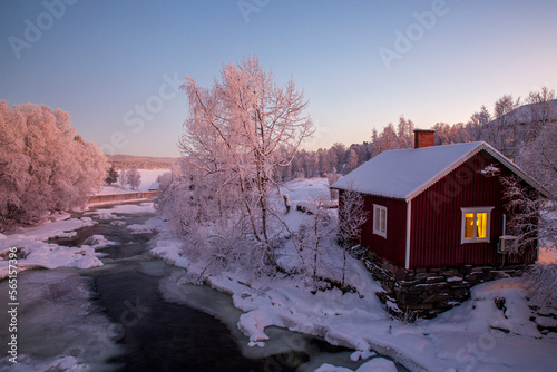Frozen landscape in sweden, on a river with a hut