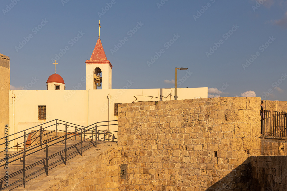 Acre, Israel - November 01, 2022, Saint John the Baptist Church and the walls of Acre Israel