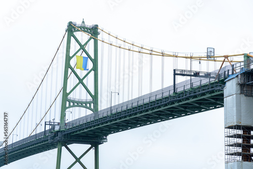 Ukrainian flag hold on Angus L. Macdonald Bridge in Halifax, Nova Scotia, Canada