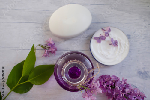 Toilet soap, lilac flower on a light background
