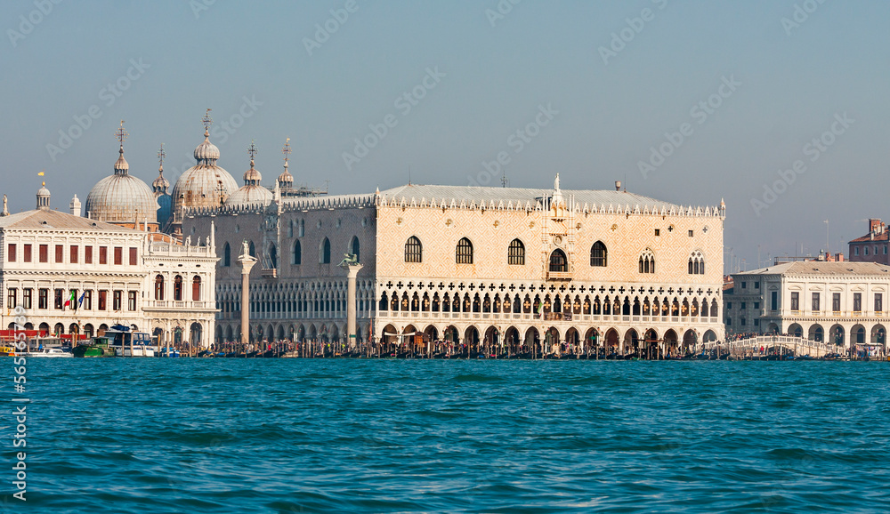 VENICE, ITALY - FEBRAURY 14, 2020: Doge's palace and Library, coloumns of St. Marco and St. Theodor from water.