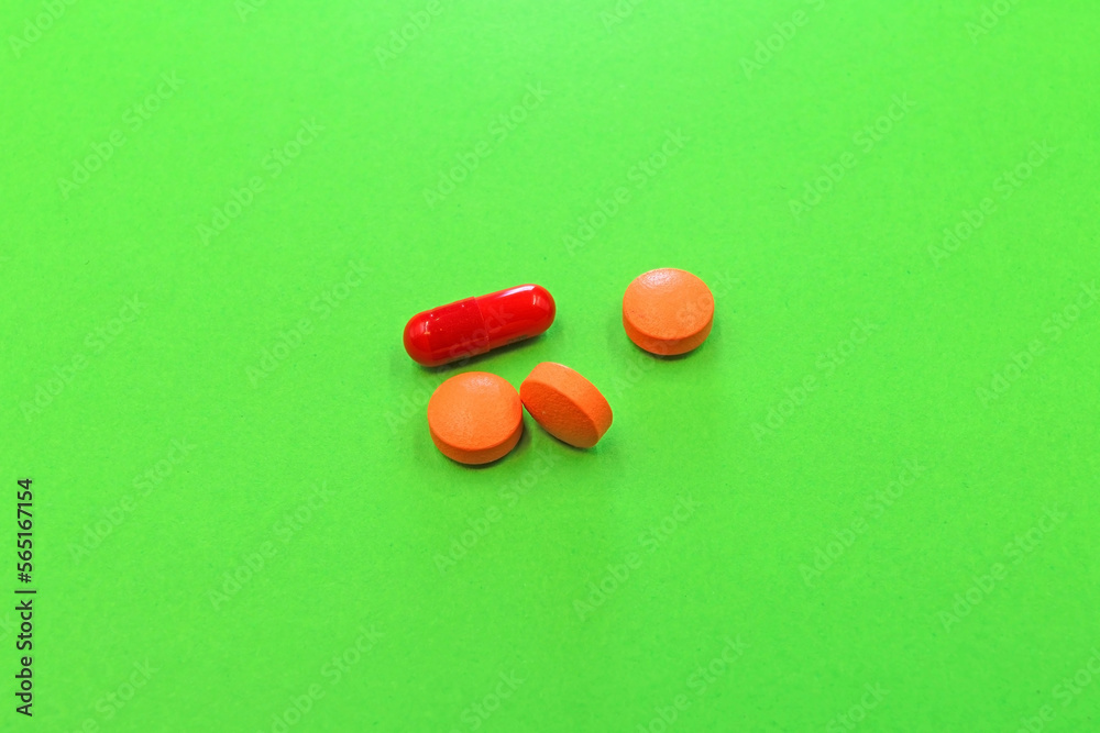 Set of drugs and pills on a green background Set of drugs and pills on a green background