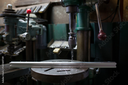 Drilling on the aluminum frame with a drilling machine 