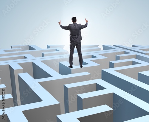 Businessman trying to escape from maze