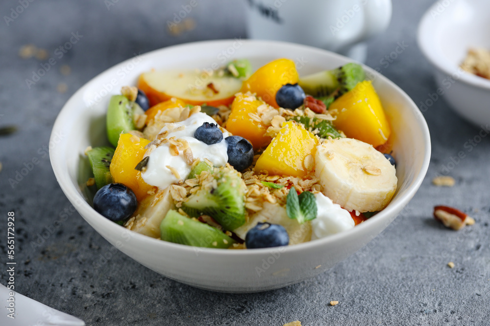Muesli with fruits served in bowl Muesli with fruits served in bowl