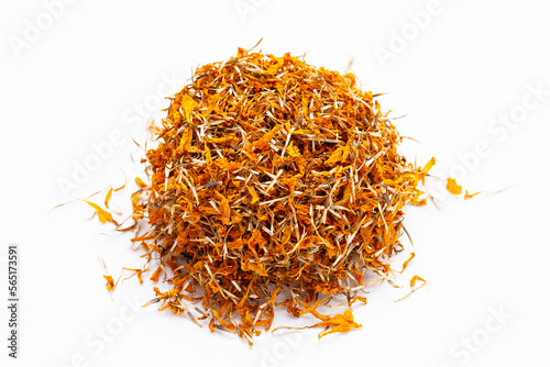 Dried marigold flower petals on white background. Flower herbal tea concept.