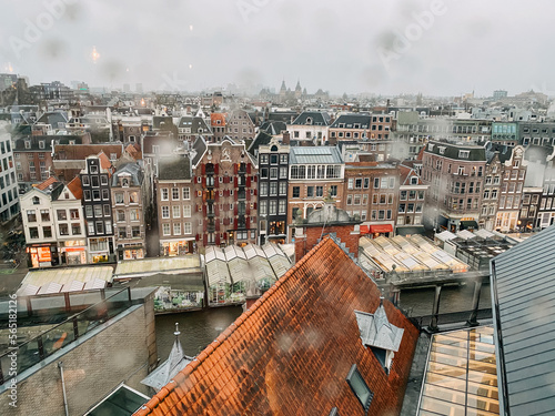 Canvas Print amsterdam houses and rooftops on the river canal street