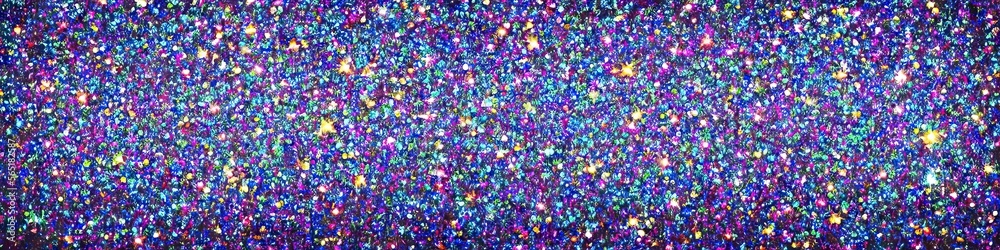 Panoramic image of polychromatic magical glitter. Full spectrum of a rainbow of colors