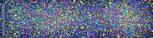 Panoramic image of polychromatic magical glitter. Full spectrum of a rainbow of colors