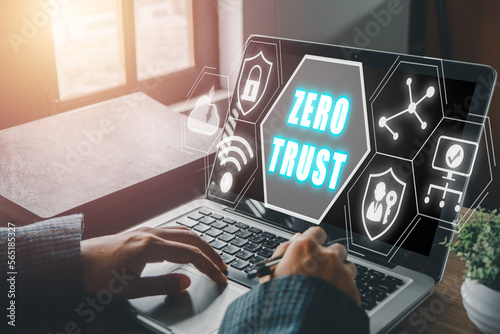 zero trust security concept, Person using computer with zero trust icon on virtual screen.