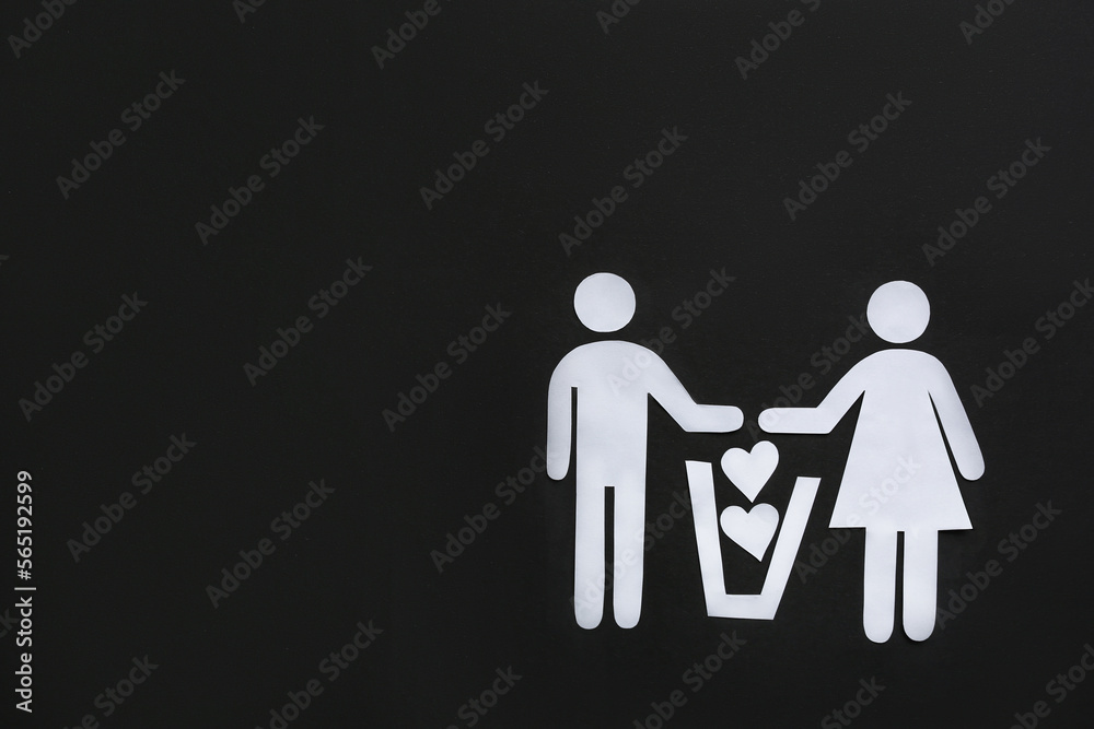 Divorce concept. Paper cutouts of couple, trash can and hearts on black background, flat lay with space for text Divorce concept. Paper cutouts of couple, trash can and hearts on black background, flat lay with space for text