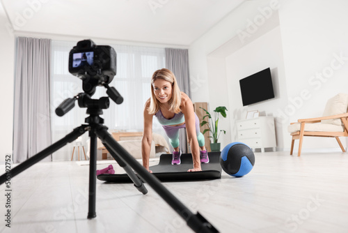 Fitness trainer recording online classes at home