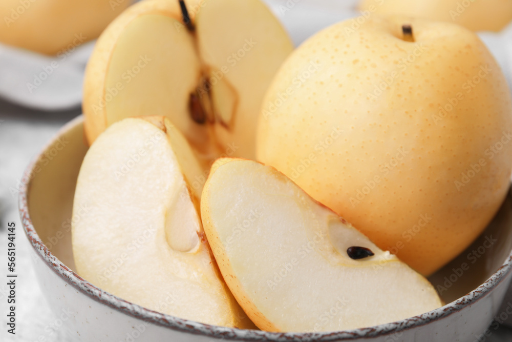 Delicious fresh apple pears in bowl, closeup Delicious fresh apple pears in bowl, closeup