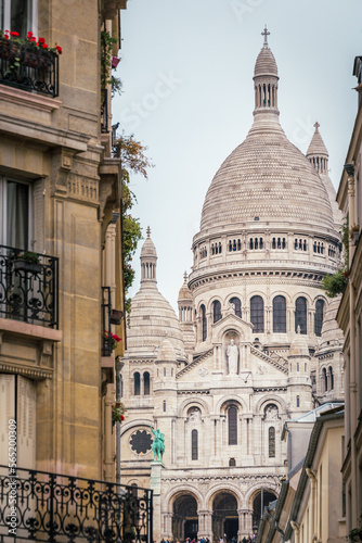 Sacre Coeur basilica behing montmartre parisien buildings, Paris, France