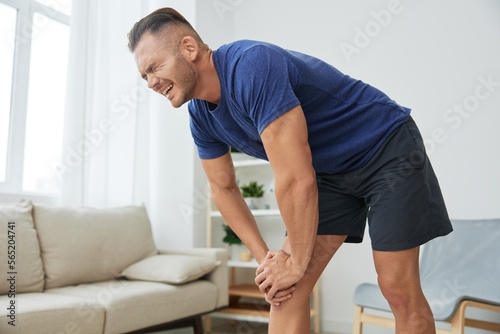 Man leg pain from exercising at home, workout injury, muscle and ligament sprain, bruise