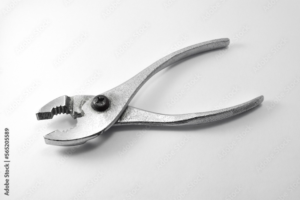 slip joint adjustable pliers wrench isolated in white background Stock