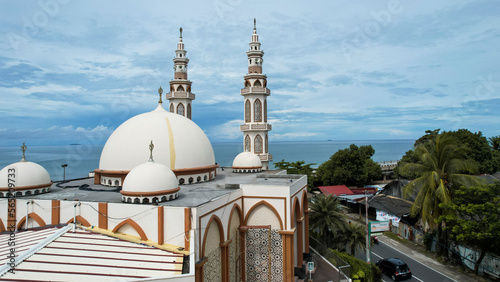 Aerial view of Mujahidin Mosque Largest Masjid in Padang, Ramadan Eid Concept background, Beautiful Landscape mosque, Islamic background Mosque, Travel and tourism.  photo