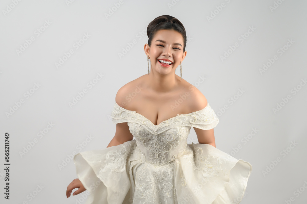 Young asian beautiful bride smiling with happy on white background Young asian beautiful bride smiling with happy on white background