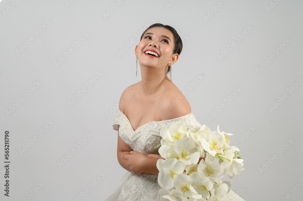 Young asian beautiful bride pose with excited feel on white background Young asian beautiful bride pose with excited feel on white background