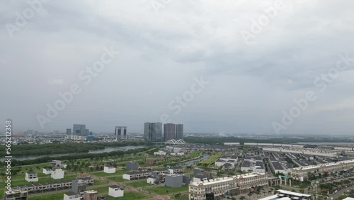 Drone sky view of crowded houses where people live, work and play in a big megapolitan capital city photo