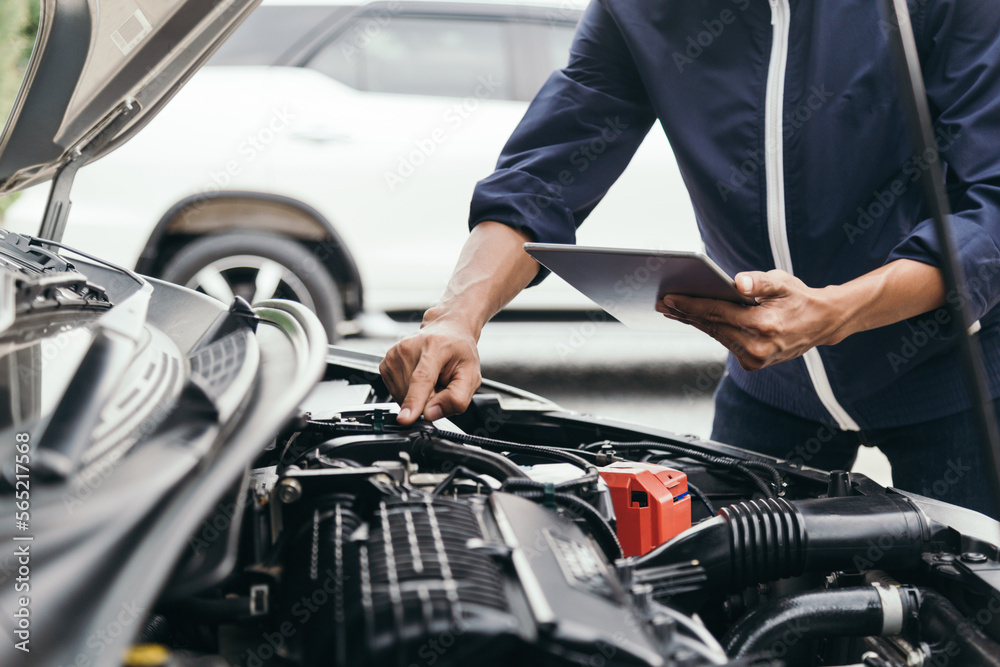 Automobile mechanic repairman hands repairing a car engine automotive workshop with a wrench, car service and maintenance,Repair service.