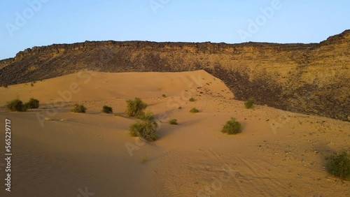 Sand Dune Cliffs in Sahara Desert, Mauritania, Africa - Aerial Establishing photo