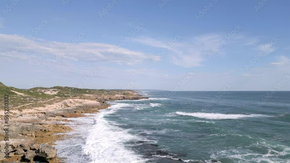 Rocky Shore and Waves Crashing along the Ocean Coast. Daytime. Drone Aerial Sweep. Rocky Shore and Waves Crashing along the Ocean Coast. Daytime. Drone Aerial Sweep.
