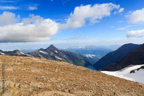 Reservoir Wasserfallboden and mountain snow panorama with summit Kitzsteinhorn in Glockner Group, Austria photo