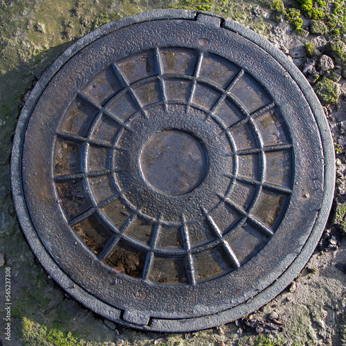 The hatch of the water well is close-up. The lid of an old well.