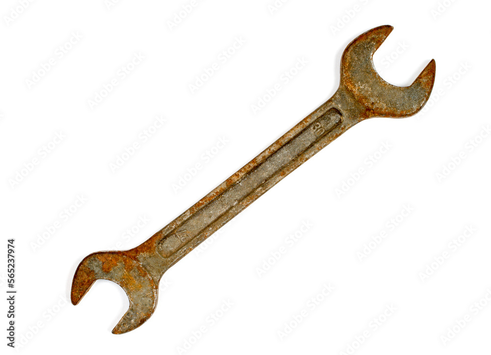 Rusty wrench on a white background. An old wrench close-up. Rusty wrench on a white background. An old wrench close-up.