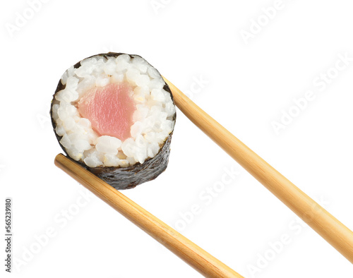 Chopsticks with tasty fresh sushi roll isolated on white