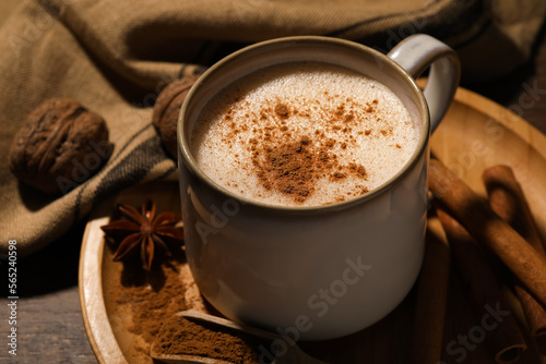 Fototapeta Naklejka Na Ścianę i Meble -  Cup of delicious eggnog with spices on wooden table