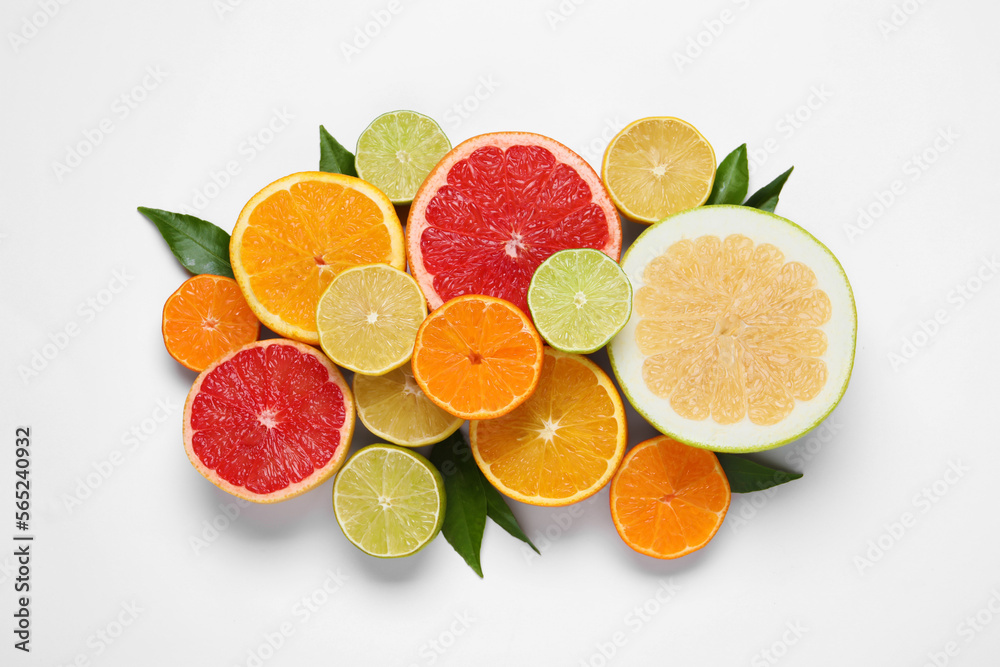 Different citrus fruits with fresh leaves on white background, top view Different citrus fruits with fresh leaves on white background, top view