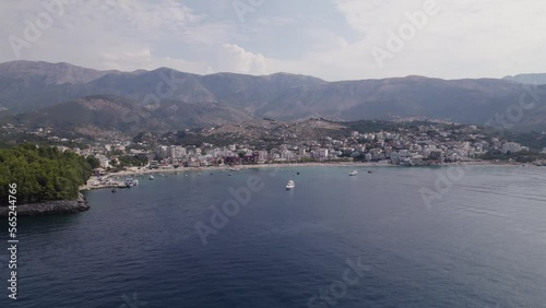 Aerial View Of Spile Beach Coastline With Mountains In Background. Slow Orbit Motion Over Ionian Sea, Establishing Shot photo