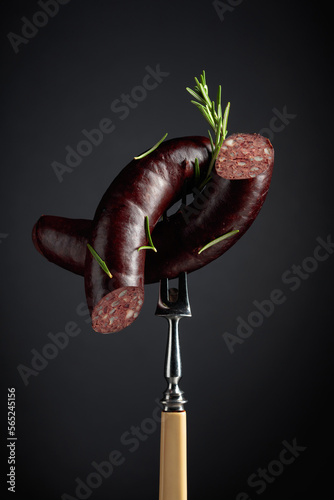 Black pudding or blood sausage with rosemary. photo