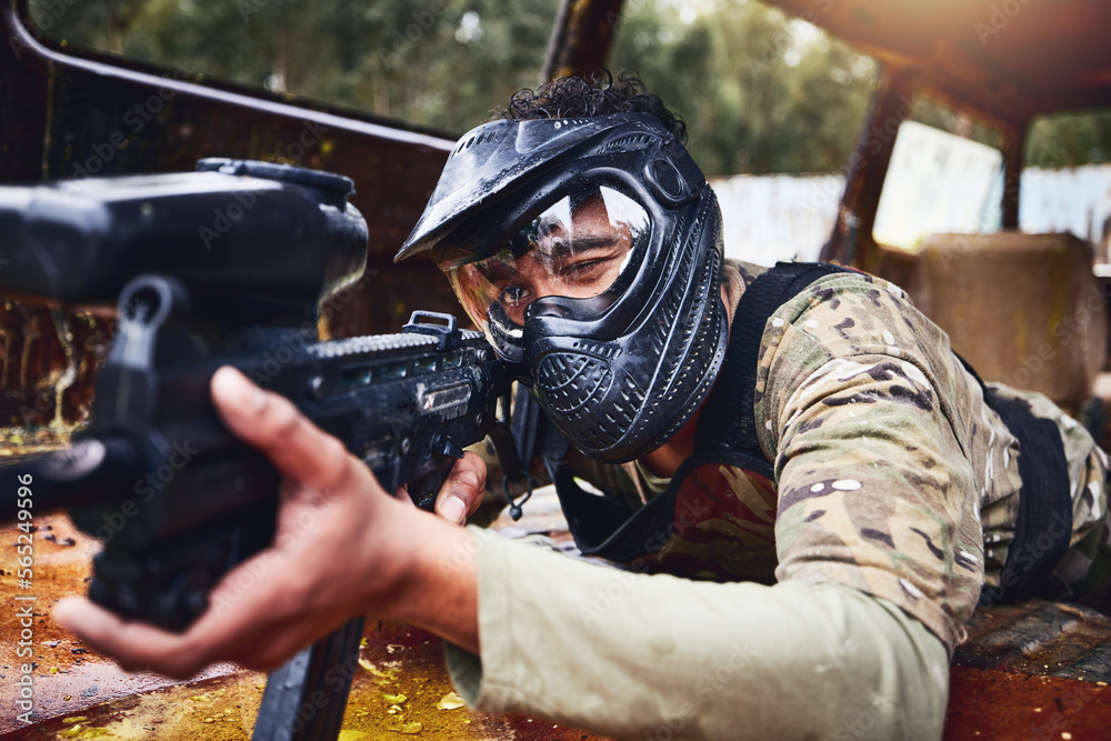 Paintball, gun or soldier in a shooting game with fast action on a fun battlefield on holiday. Military mission, target or focused man with war weapons gear for survival in an outdoor competition Paintball, gun or soldier in a shooting game with fast action on a fun battlefield on holiday. Military mission, target or focused man with war weapons gear for survival in an outdoor competition