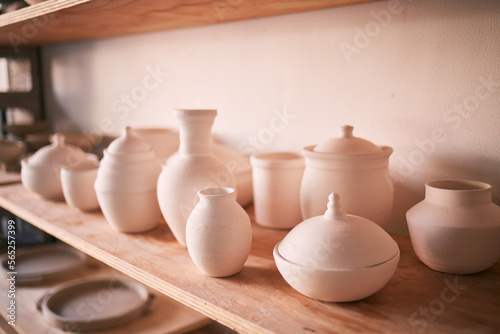 Pottery background, ceramics and shelf in workshop, creative store or manufacturing startup. Clay products, collection and display in studio, small business and retail craft shop of stock production